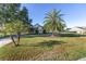 Charming single-story home with well-maintained lawn, palm trees, and a spacious driveway at 4083 Se 38Th Loop, Ocala, FL 34480