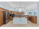 This ample kitchen features a center island, stainless steel appliances, and granite countertops at 4083 Se 38Th Loop, Ocala, FL 34480