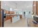 The spacious kitchen offers wooden cabinets, granite counters, and stainless-steel appliances at 4083 Se 38Th Loop, Ocala, FL 34480