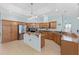 The wide-open kitchen showcases stainless steel appliances, wooden cabinetry, and a spacious layout at 4083 Se 38Th Loop, Ocala, FL 34480