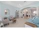 Open-concept living room with archways, light blue walls, and bright natural light at 4083 Se 38Th Loop, Ocala, FL 34480