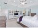 Bright and spacious main bedroom with a white bedspread and flat-screen TV at 4083 Se 38Th Loop, Ocala, FL 34480