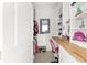 Organized walk-in closet with built-in shelving, desk space, and a mirror, offering ample storage and functionality at 4083 Se 38Th Loop, Ocala, FL 34480
