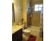 Cozy bathroom featuring brown-tile shower and tub, vanity, and window at 4770 Sw 114Th St, Ocala, FL 34476