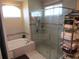 Bright bathroom with jetted tub and glass shower includes a window to let in natural light at 4770 Sw 114Th St, Ocala, FL 34476