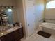 Spacious bathroom with dual sinks, a soaking tub and a separate tiled shower at 4770 Sw 114Th St, Ocala, FL 34476