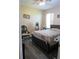 Comfortable bedroom features a ceiling fan, window, and hardwood floors at 4770 Sw 114Th St, Ocala, FL 34476