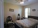 Comfortable bedroom features a ceiling fan, window, and hardwood floors at 4770 Sw 114Th St, Ocala, FL 34476