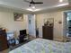 Bright bedroom with a tray ceiling, showcasing furnishings, and creating a relaxing personal space at 4770 Sw 114Th St, Ocala, FL 34476