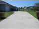 Long driveway leading to a well-maintained home with fenced backyard at 4770 Sw 114Th St, Ocala, FL 34476