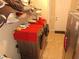 Functional laundry room with appliances and storage space; the perfect space for chores at 4770 Sw 114Th St, Ocala, FL 34476