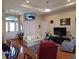Inviting living room with hardwood floors, tray ceiling, and comfortable seating at 4770 Sw 114Th St, Ocala, FL 34476