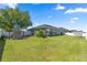 Expansive backyard features a large lawn, fenced yard, and well maintained lawn at 4939 Sw 99Th Pl, Ocala, FL 34476