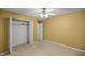 Bedroom with carpet and walk-in closet at 4939 Sw 99Th Pl, Ocala, FL 34476