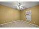 Bedroom with carpet and window at 4939 Sw 99Th Pl, Ocala, FL 34476