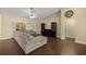 Comfortable living room with wood floors, a ceiling fan, and neutral decor at 4939 Sw 99Th Pl, Ocala, FL 34476
