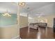Open concept living room featuring hardwood floors and neutral-toned walls with recessed lighting at 4939 Sw 99Th Pl, Ocala, FL 34476