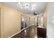 An office space with hardwood flooring and sliding glass doors, offering a bright work environment at 4939 Sw 99Th Pl, Ocala, FL 34476