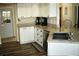Updated kitchen featuring stainless steel appliances, granite countertops, and white cabinetry at 5281 Sw 33Rd St, Ocala, FL 34474