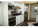 Modern kitchen showcasing stainless steel appliances, granite countertops, and white cabinetry at 5281 Sw 33Rd St, Ocala, FL 34474