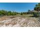 Spacious backyard showcasing mature trees, a charming gazebo, and ample space for recreation at 6045 Ne 65Th St, Silver Springs, FL 34488