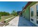 The backyard has an expansive grassy area, lush landscaping, and patio with plenty of room for entertaining at 6045 Ne 65Th St, Silver Springs, FL 34488