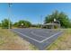 Community basketball court with lighting, and a nearby pavilion at 6045 Ne 65Th St, Silver Springs, FL 34488