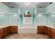 Stylish bathroom with dual vanities, soaking tub, tile floor, and decorative lighting at 6045 Ne 65Th St, Silver Springs, FL 34488