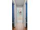Hallway view of the bathroom featuring a soaking tub and plenty of natural light at 6045 Ne 65Th St, Silver Springs, FL 34488