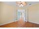 Bedroom with wood floors and open French doors, creating a seamless flow between spaces and enhancing natural light at 6045 Ne 65Th St, Silver Springs, FL 34488