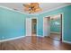 Bedroom featuring an ensuite bathroom, walk-in closet, and laminate flooring at 6045 Ne 65Th St, Silver Springs, FL 34488