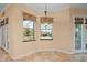 Cozy breakfast nook with bay windows overlooking the pool and patio area at 6045 Ne 65Th St, Silver Springs, FL 34488