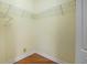 Walk in closet with wood laminate flooring and wire shelving at 6045 Ne 65Th St, Silver Springs, FL 34488