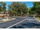 Gated community entrance with brick pillars, mature trees, and well-maintained landscaping at 6045 Ne 65Th St, Silver Springs, FL 34488