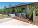 Side view of the house features a generator, AC units, and well-maintained landscaping at 6045 Ne 65Th St, Silver Springs, FL 34488