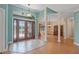 Spacious foyer with detailed double doors and an open view into the dining area at 6045 Ne 65Th St, Silver Springs, FL 34488