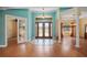 Grand foyer with high ceilings, decorative doors, and adjacent dining area at 6045 Ne 65Th St, Silver Springs, FL 34488
