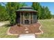Charming gazebo surrounded by lush trees, offering a peaceful retreat in the backyard at 6045 Ne 65Th St, Silver Springs, FL 34488