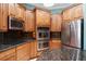 Updated kitchen featuring modern stainless appliances, sleek granite countertops, and stylish wood cabinets at 6045 Ne 65Th St, Silver Springs, FL 34488