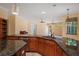 Spacious kitchen featuring granite countertops and modern appliances, seamlessly flowing into the adjacent living spaces at 6045 Ne 65Th St, Silver Springs, FL 34488