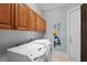 Laundry room with washer and dryer, ample cabinet space and tile floors at 6045 Ne 65Th St, Silver Springs, FL 34488