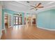 Spacious living room with wood floors, columns, and coffered ceilings, offering an elegant and inviting atmosphere at 6045 Ne 65Th St, Silver Springs, FL 34488