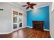 Cozy living room featuring fireplace and French doors to outdoor space and a view of the pool at 6045 Ne 65Th St, Silver Springs, FL 34488