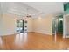 Bright living room featuring wood floors, recessed lighting and sliding doors opening to the outdoor pool area at 6045 Ne 65Th St, Silver Springs, FL 34488