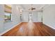 Open concept living room featuring hardwood floors and ample natural light at 6045 Ne 65Th St, Silver Springs, FL 34488
