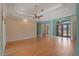Open-concept living room features hardwood floors and a view into the foyer at 6045 Ne 65Th St, Silver Springs, FL 34488