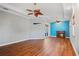 Modern living room features a fireplace and wood flooring at 6045 Ne 65Th St, Silver Springs, FL 34488