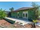 Cozy patio features double doors, stylish accents, and serene views of the pool and landscaping at 6045 Ne 65Th St, Silver Springs, FL 34488