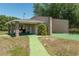 Community racquetball court, with brick columns and a nearby walkway at 6045 Ne 65Th St, Silver Springs, FL 34488