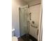 Modern bathroom with a glass door shower and a tiled shower wall at 627 Vagabond St, The Villages, FL 32163